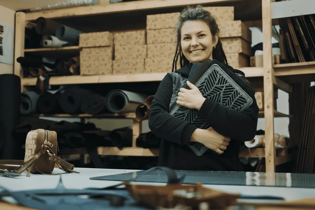 Gold Coast engraver holding completed engraving work